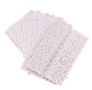 Laser cut ivory lace wedding invitation cards with intricate floral patterns set