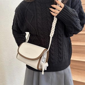 French style crossbody bag in cream leather with contrast trim and woven strap