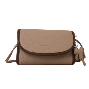 Retro beige leather crossbody flap bag with wide strap and cute elephant pendant