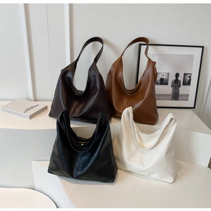 Minimalist Hobo tote bags in four colors on white steps with high-quality leather texture