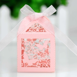 Detail of laser-cut butterfly hollow gift box with elegant white silk ribbon bow
