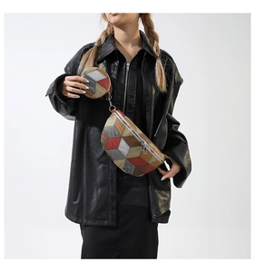 Detail of trendy patchwork waist bag and round coin purse on black leather jacket