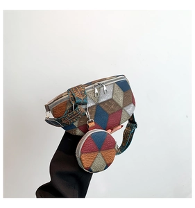 Close-up of geometric patchwork fanny pack with round pouch and jacquard strap