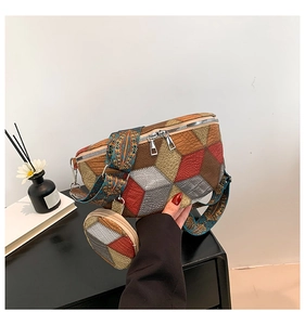 Detail of multi-color patchwork waist bag with embroidered wide strap and double zippers