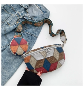Detail of color-block leather crossbody bag with ethnic strap and small round coin purse