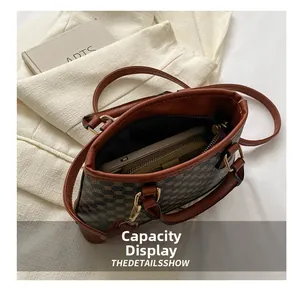 Practical capacity display showing a vintage checkered bag holding a phone and long wallet