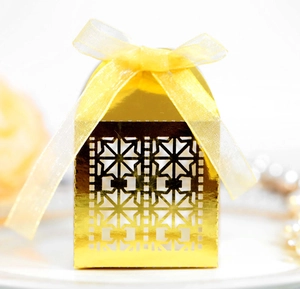 Golden laser-cut wedding favor box with yellow ribbon bow for candy or gifts