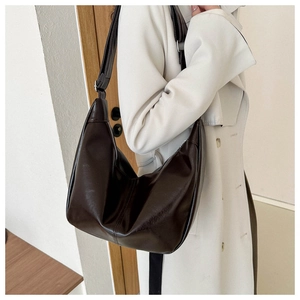 Deep brown large-capacity hobo bag with glossy finish and adjustable shoulder strap