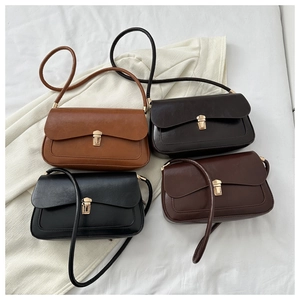 Flat lay of four vintage square bags in brown, dark brown, black, and wine red leather