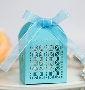 Close-up of laser-cut window pattern on Tiffany blue gift box with ribbon bow