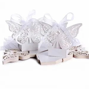 White laser cut butterfly wedding favor boxes with satin ribbon for candies