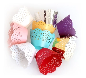 Laser-cut floral lace cupcake wrappers in assorted colors with intricate hollow patterns