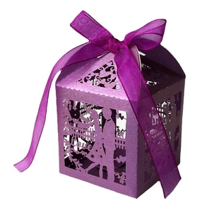 Laser-cut purple wedding favor box with Love pattern and matching organza ribbon