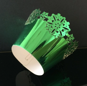 Metallic green laser cut snowflake cupcake wrappers for Christmas dessert decorations