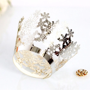 Golden snowflake crown cake wrapper with intricate laser-cut hollow metal finish