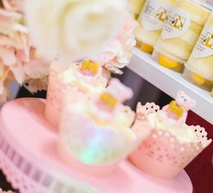 Detailed laser cut pink lace cupcake liners and cute bear toppers for party decoration