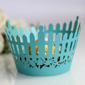 Tiffany blue laser-cut paper cupcake wrappers with floral patterns for weddings