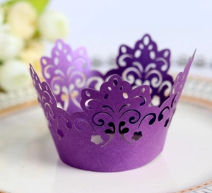 Purple laser cut cupcake wrappers with hollow crown pattern for wedding party decoration