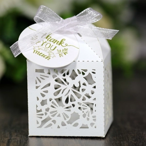 Laser cut white wedding favor box with glitter ribbon and round thank you tag