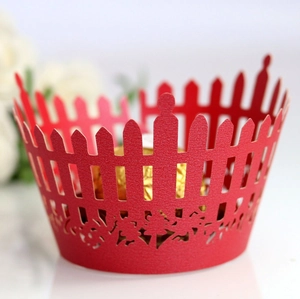 Red laser-cut picket fence cupcake wrapper with delicate floral patterns for weddings