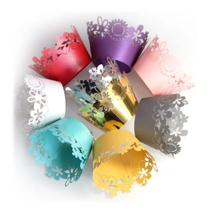 Laser-cut sunflower cupcake wrappers in various pearlized colors arranged in a circle