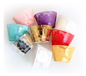Laser cut white rose lace cupcake liners in multiple colors with pearlized paper finish