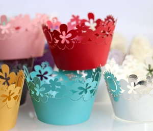 Macro view of laser-cut sunflower cupcake wrappers in vibrant mixed colors