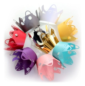Laser cut high heel cupcake wrappers in gold and pearl colors for wedding party decoration