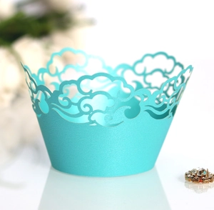 Elegant mint blue laser-cut cloud cupcake wrappers with hollow lace texture