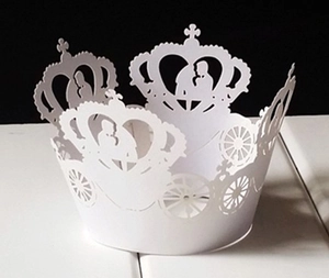 Detailed white laser-cut cupcake wrapper with romantic couple silhouette and crown design