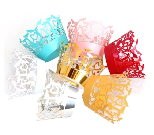 Laser-cut LOVE heart cupcake wrappers in multiple metallic colors for wedding party decoration