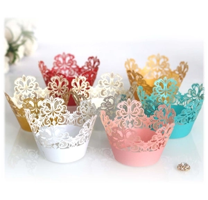 Intricate laser-cut crown cupcake wrappers in seven assorted colors for wedding decor