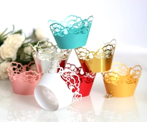 Laser-cut hollow cloud cupcake liners in multiple colors for festive party decorations