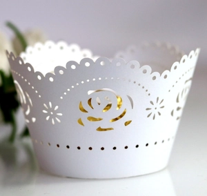 White laser cut cupcake wrappers with hollow rose floral pattern for elegant party decor
