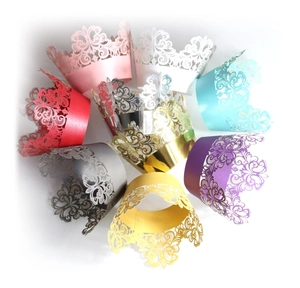 Laser cut hollow lace cupcake wrappers in multiple vibrant colors for party decorations
