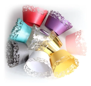 Laser cut lace cupcake wrappers in multiple vibrant colors for wedding party decoration