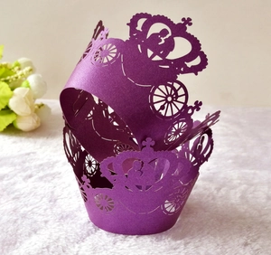 Detailed laser-cut purple cupcake wrappers with elegant carriage and crown hollow designs