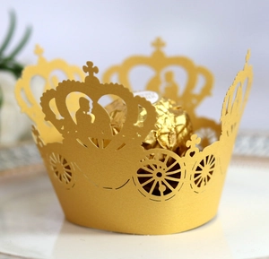 Macro detail of laser-cut crown pumpkin carriage paper holder for chocolates