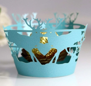 Laser-cut light blue cupcake wrappers featuring reindeer hollow design for Christmas party decor
