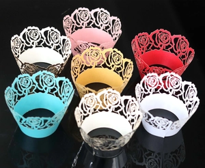 Laser-cut rose paper cupcake wrappers in multiple colors for wedding party decorations