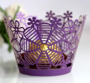Purple laser-cut lace cupcake wrapper with intricate floral and hollow pattern for parties