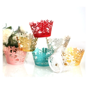 Laser cut snowflake cupcake wrappers in various colors for Christmas party decorations