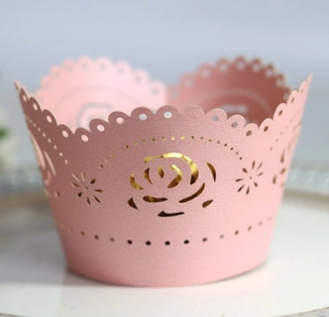 Pink laser cut rose flower cake wrapper for weddings and parties on white plate