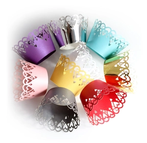 Laser cut heart cupcake wrappers in assorted metallic colors for wedding and party decor