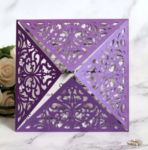 Detail of laser-cut purple invitation card with pearlescent finish and white insert