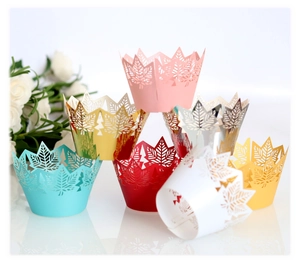 Elegant laser-cut cupcake wrappers with maple leaf patterns in assorted metallic colors