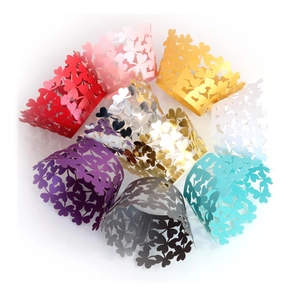 Detail of laser-cut clover pattern cupcake wrappers in various pearlescent colors