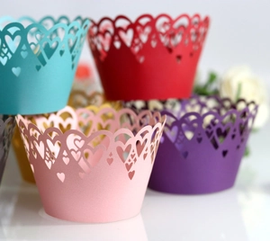 Laser cut heart cupcake liners in various colors for wedding and party decorations