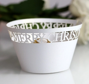 White laser-cut Merry Christmas cupcake wrappers for festive muffin dessert decoration