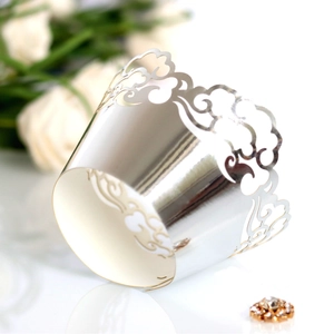 Elegant laser-cut silver cupcake wrapper with intricate hollow lace for wedding parties